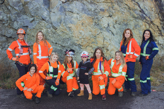 A Group Of Women In Sustainable Work Clothes (Covergalls Coveralls)